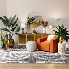 ljust vardagsrum med växter och orange fåtölj